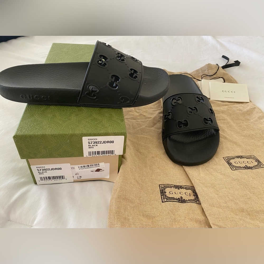 Size 40 Black Gucci slides.